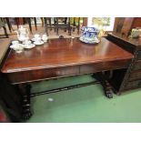 A William IV rosewood library table the two frieze drawers over a lyre end base joined by a turned