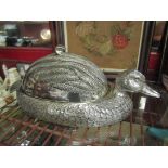 A silver plated duck shaped wine carafe and a silver plated duck shaped serving dish