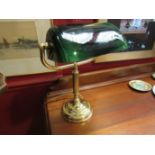 A green glass bankers lamp