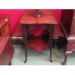 An Art Nouveau mahogany occasional table on outswept feet,