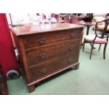 A walnut three drawer chest on bracket feet,