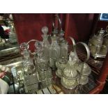 Three silver plated and glass cruet sets