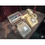 A cream dial telephone and another a/f with a switchboard (3)
