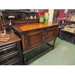 An oak two door sideboard raised gallery back on stretcher base,