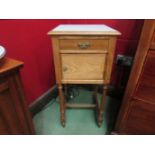 A French bedside cupboard with white tiled top,