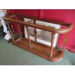 A 19th Century country house pitch pine large stick stand on turned supports,