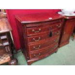A George III style crossbanded mahogany bow front chest of four graduating long drawers below a