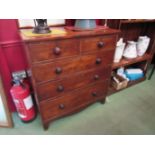 A 19th Century mahogany two over three chest of drawers with bun handles and bracket feet,