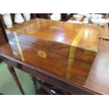 An oak and brass banded writing slope with gilt tooled leather interior,