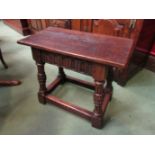 A 17th Century carved oak joint stool,