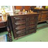 An 18th Century elm and oak panelled country chest of four long drawers with moulded front