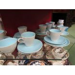 A Poole two tone pottery teaset comprising of eight cups and saucers, eight side plates,