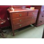 An Edwardian walnut two over two drawer dressing chest,