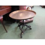 An engraved brass tray top table on ibex horn brass capped base,