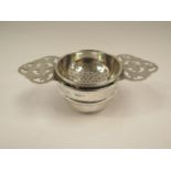 A silver tea strainer, Sheffield 1879 and a silver bowl, Sheffield,