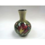 A Moorcroft vase with anemone design, green ground,