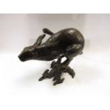 A large solid bronze running hare, 24cm tall,