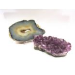 A amethyst geode and a slice of specimen agate