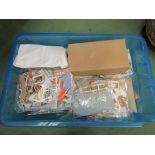 A box containing partially filled stamp albums and loose stock stamps from across the World,