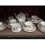 A Minton Ancestral pattern teaset with all over floral design
