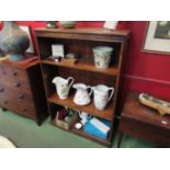 An oak floor standing bookcase with adjustable shelves, beading a/f,