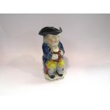 A Victorian Staffordshire Toby jug with hat lid,