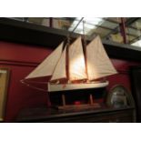 A handbuilt model ship "Huron" on display stand, approximately 85cm long,