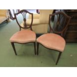 A pair of 19th Century hand painted Sheraton style chairs by Edwards & Roberts,