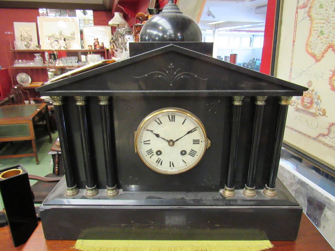 A Victorian black slate mantel clock of architectural form, with key,