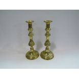 A pair of brass candlesticks,