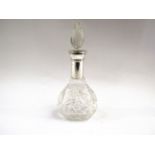 A perfume bottle with long silver collar and crystal stopper,