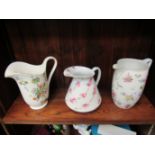 Three jugs including Devon Ware and Royal Hampton examples