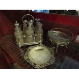 A silverplate cruet stand with part bottle contents,