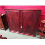 A George III flame mahogany two door estate cupboard with key the fitted five drawer interior and