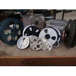 A quantity of assorted empty tape tape reel spools