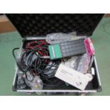 A metal case containing Bespeco volume pedal, guitar strings,