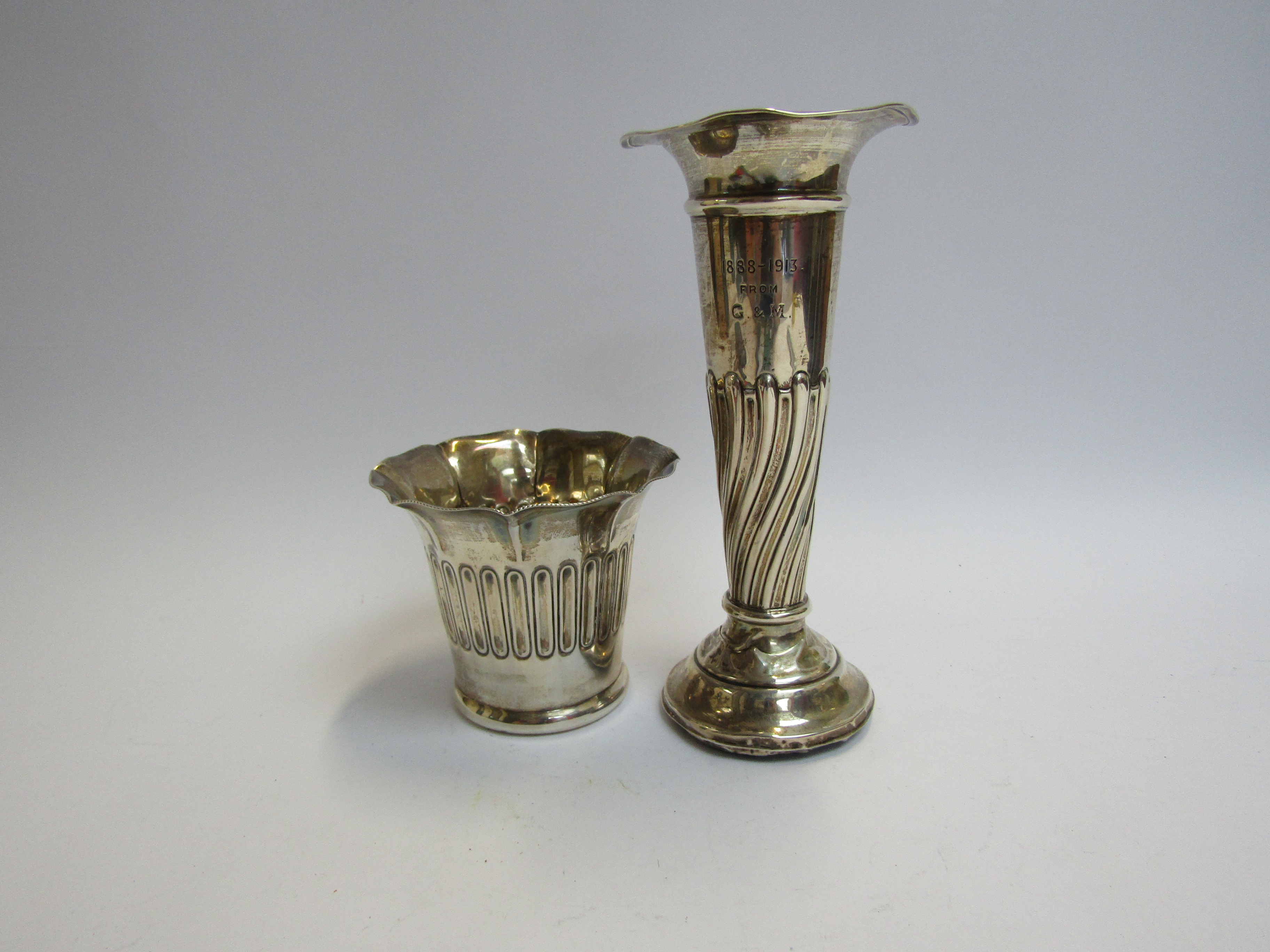 A silver engraved trumpet vase with weighted base (dented) 18cm tall and Maxfield & Sons Ltd silver