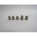 Five various silver thimbles various makers dates and conditions,