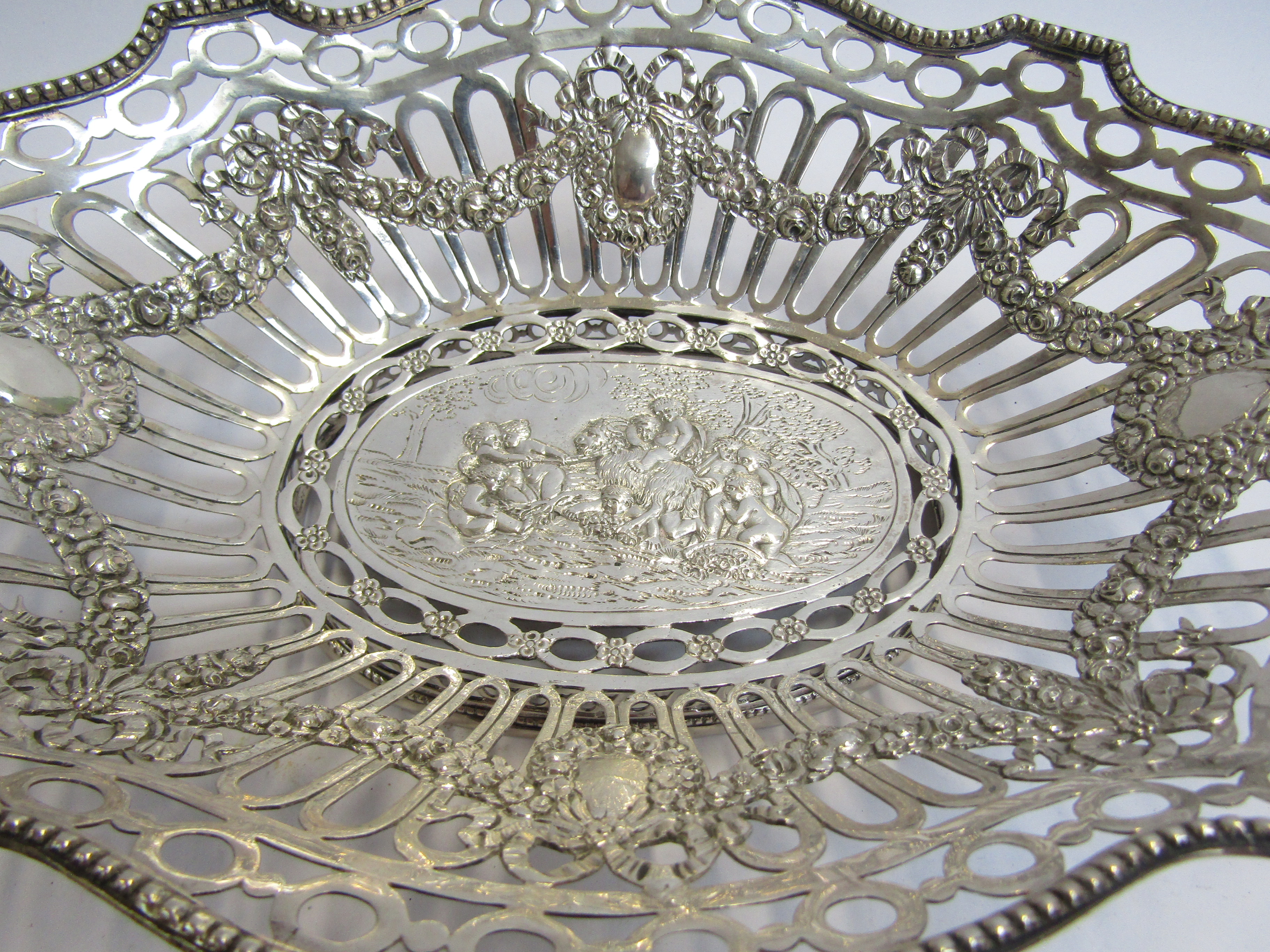 A continental silver pierced basket embossed design, stamped 800, 26cm long x 7cm tall, - Image 3 of 4