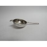 A silver tea strainer London 1945,