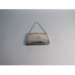 A rectangular silver purse, Birmingham 1913, marks rubbed, 10.