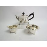 An associated silver three piece tea set, matching cream jug and sugar bowl by Barker Brothers,