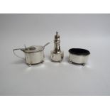 A William Aitken silver three piece cruet (mustard blue glass liner missing), Birmingham1911,