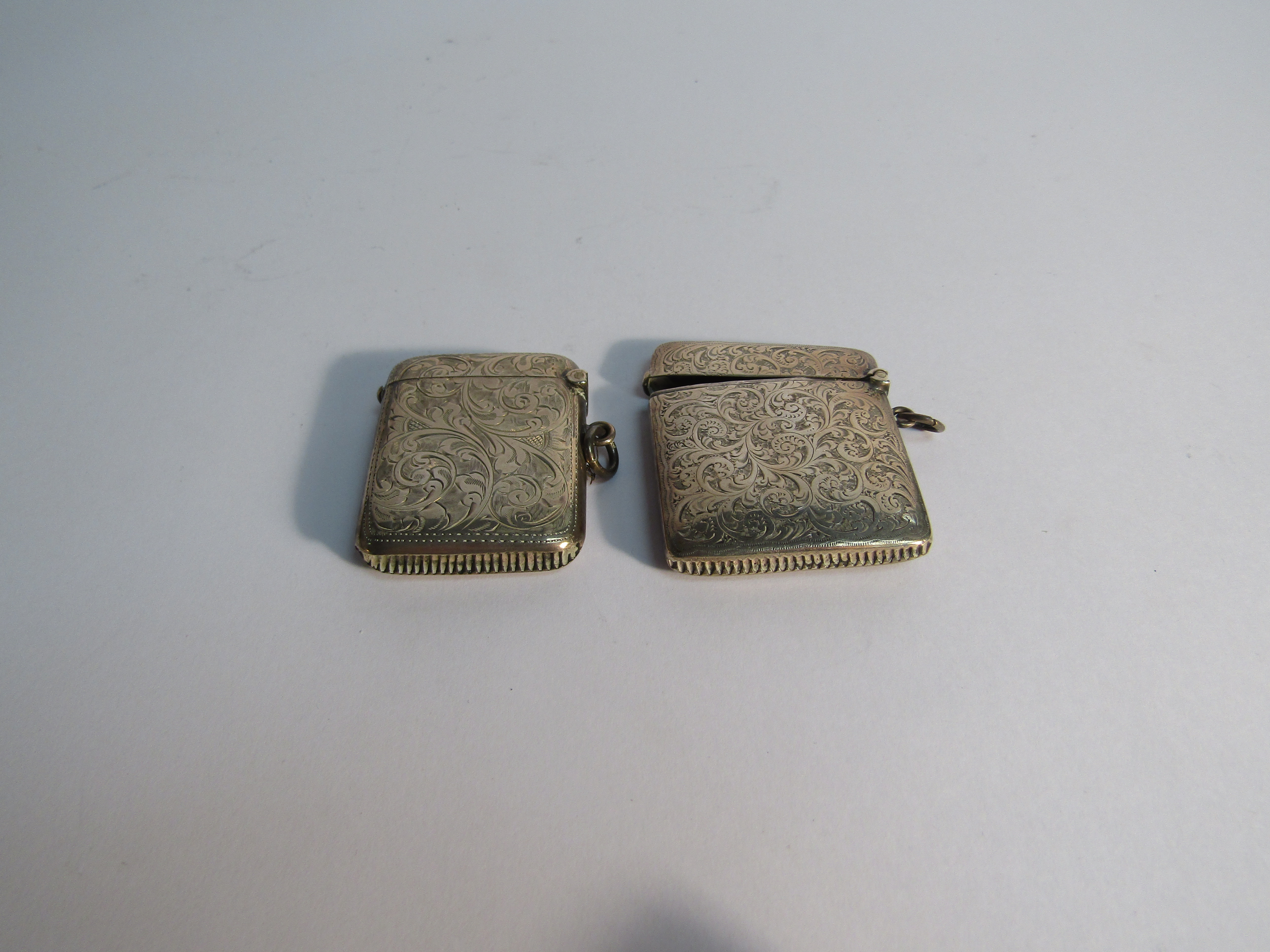 Two silver Vesta cases with all over engraved detail, both 5cm tall, one monogrammed, - Image 2 of 2