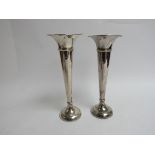 Two similar Sanders & Mackenzie silver trumpet vases with weighted bases, Birmingham 1954,