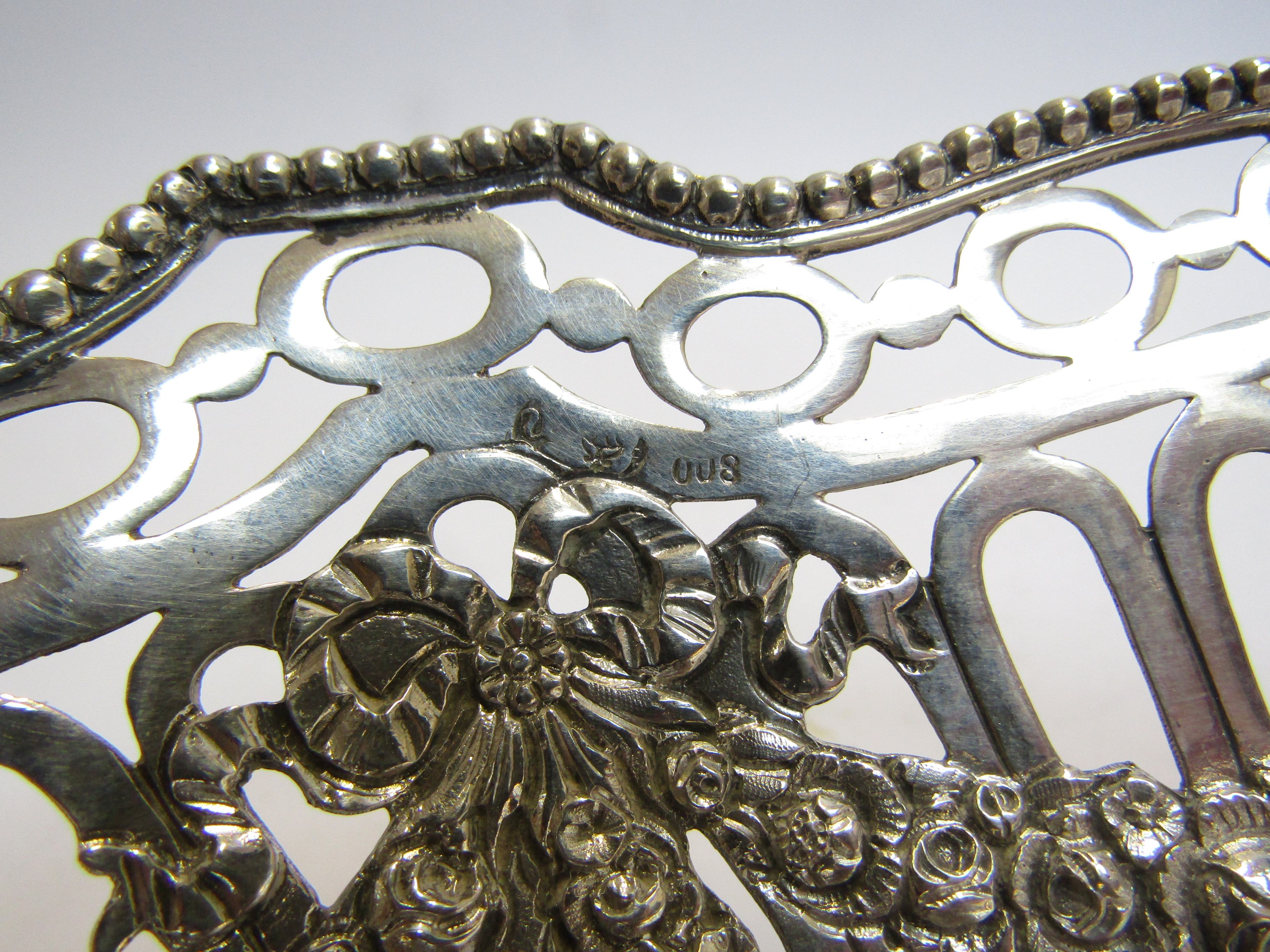 A continental silver pierced basket embossed design, stamped 800, 26cm long x 7cm tall, - Image 4 of 4