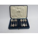 A Harrods Ltd silver coffee spoon and tongs set, monogrammed, London 1929,
