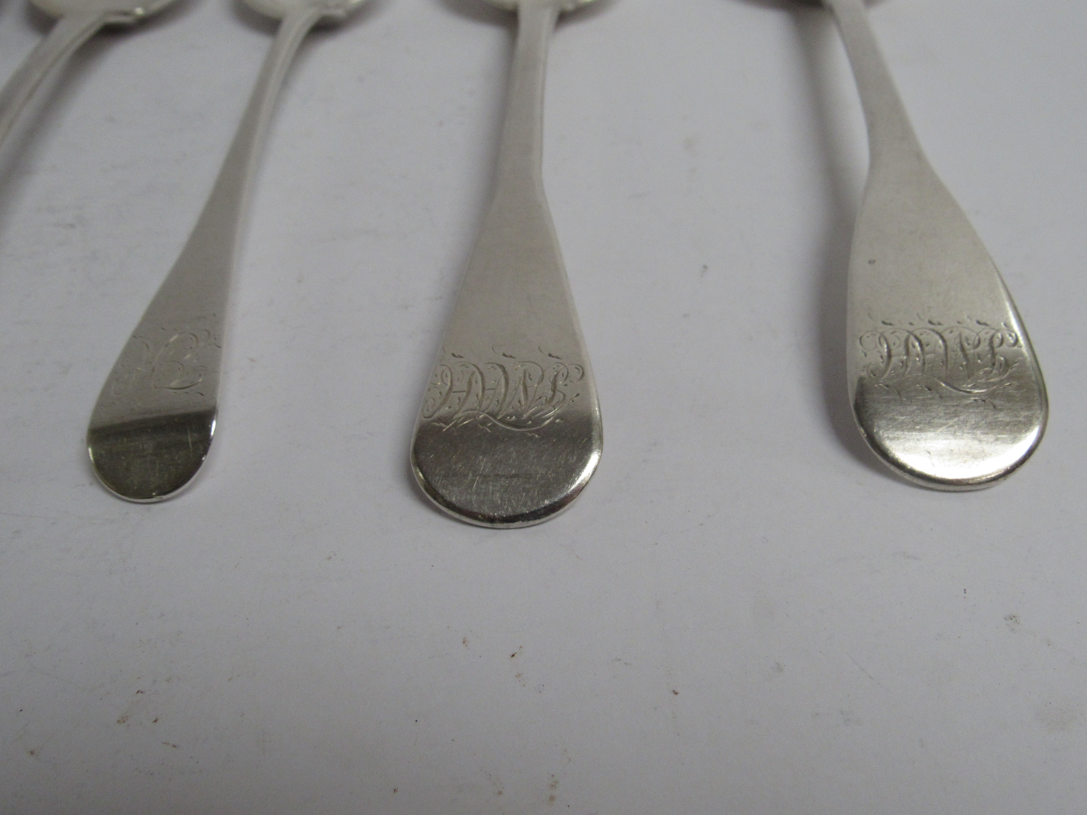 Six various Georgian serving spoons, five with monogrammed handles, - Image 3 of 5