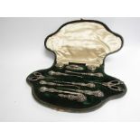 An Edwardian silver handled and topped manicure set,