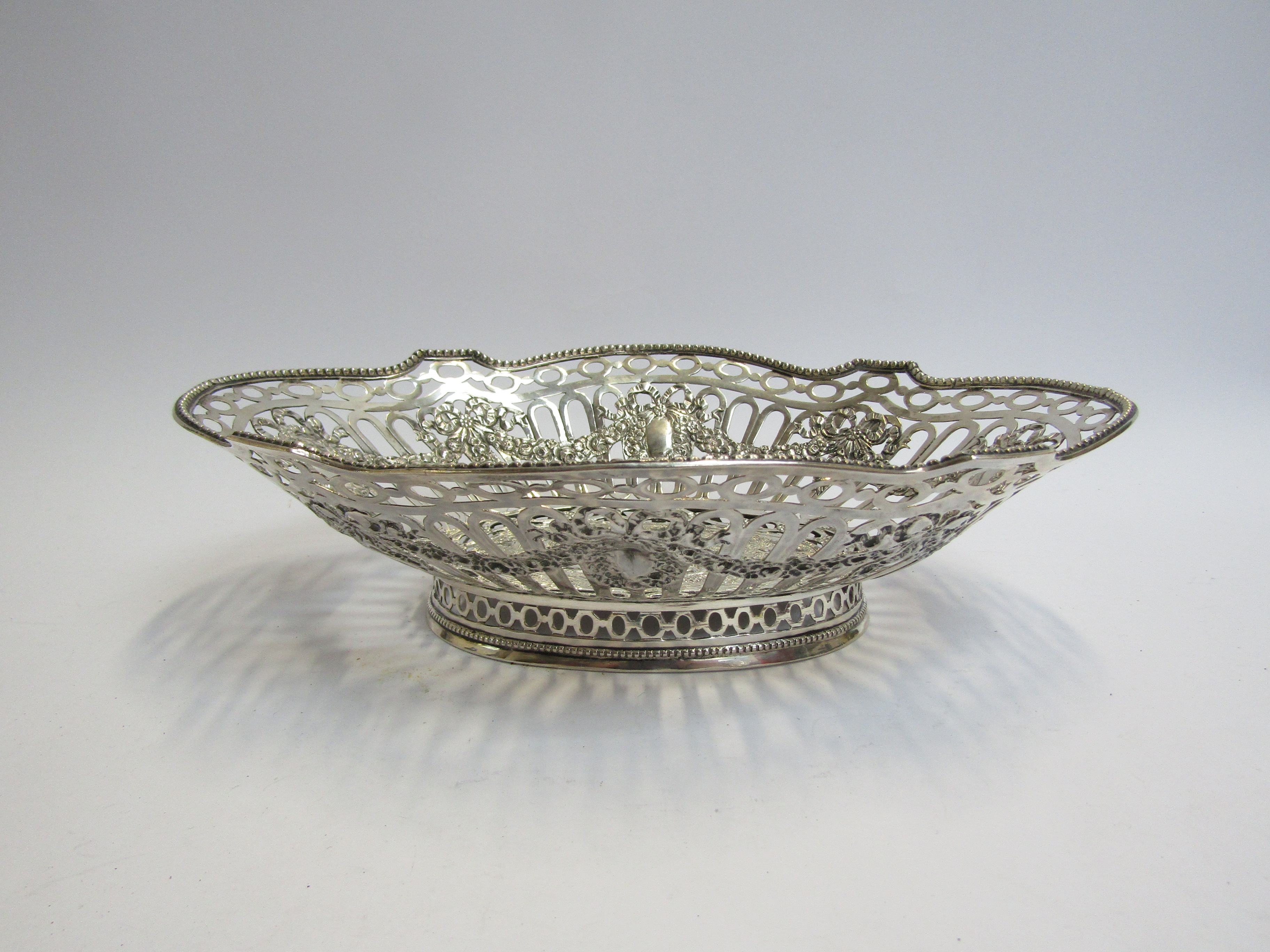 A continental silver pierced basket embossed design, stamped 800, 26cm long x 7cm tall, - Image 2 of 4